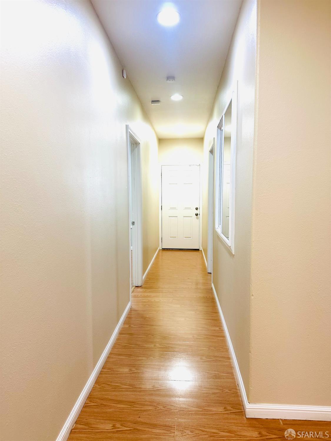 5654 Mission Street San Francisco, CA 94112 - Photo 12 of 15 a view of a hallway with wooden floor