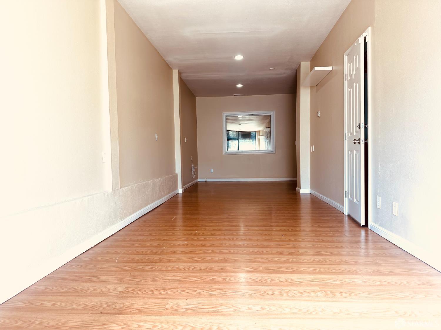 5654 Mission Street San Francisco, CA 94112 - Photo 7 of 15 a view of empty room with wooden floor