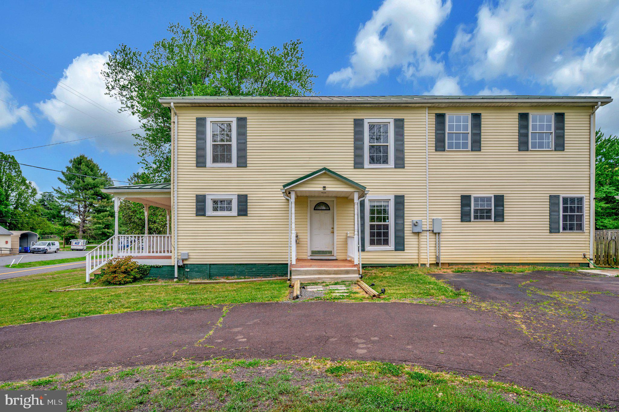23202 Village Road Unionville, VA 22567 - Photo 51 of 58 a front view of a house with a yard and garage
