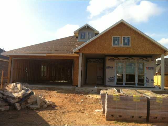 2512 Winchell Lane Austin, TX 78725 - Photo 1 of 1 a front view of a house with a yard