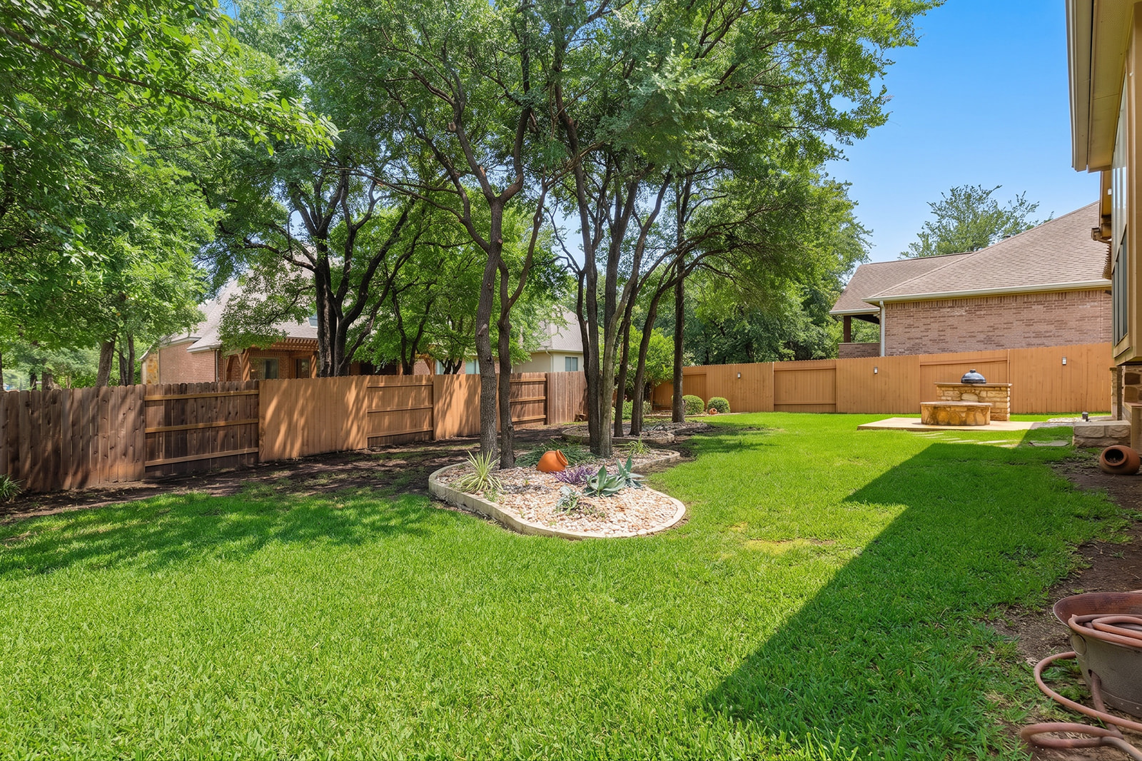 114 North Saddle Ridge Drive Cedar Park, TX 78613 - Photo 39 of 40 a view of a backyard with table and chairs and wooden fence