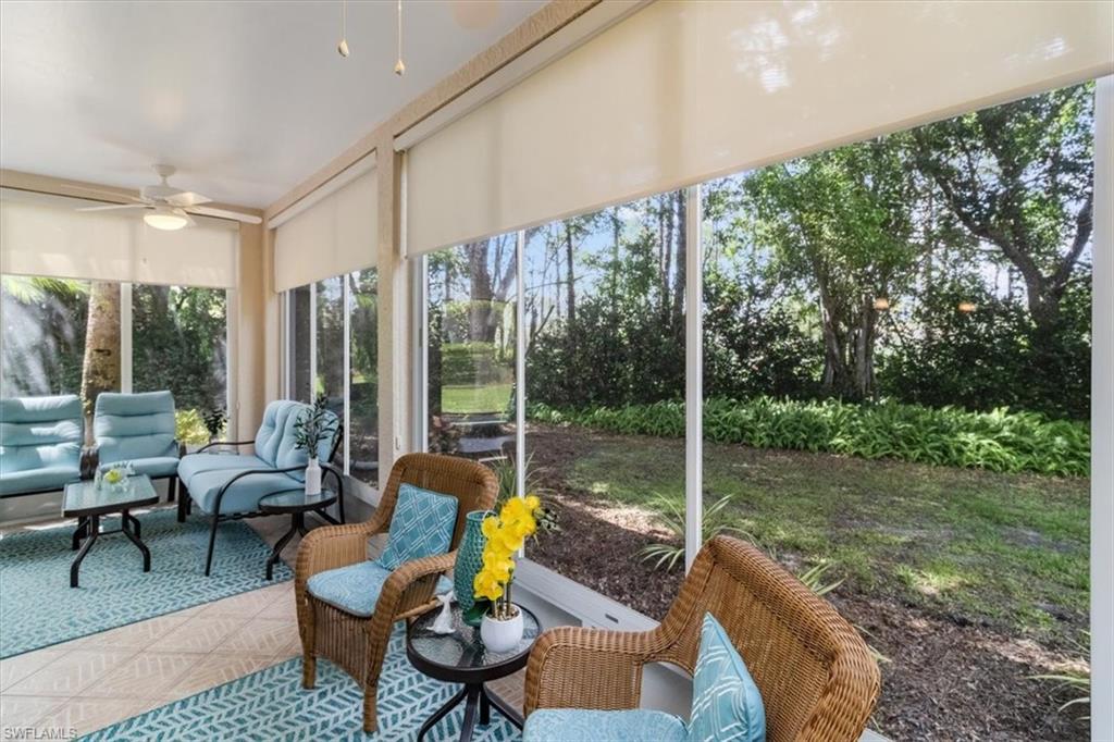 873 Carrick Bend Circle, Unit 101 Naples, FL 34110 - Photo 15 of 42 a view of a patio with couches chairs and a potted plant