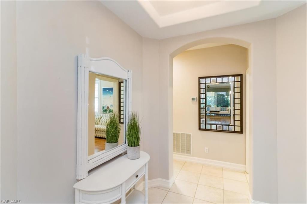 873 Carrick Bend Circle, Unit 101 Naples, FL 34110 - Photo 28 of 42 a bathroom with a toilet sink and tub