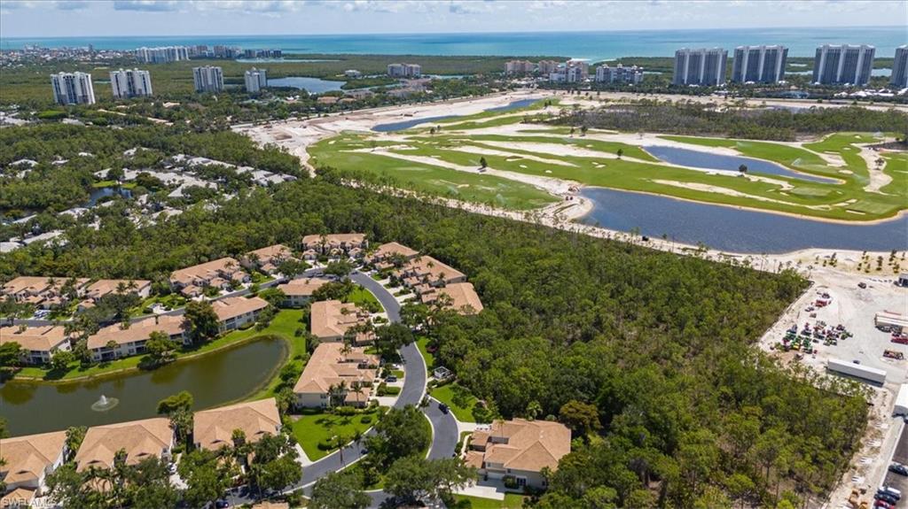 873 Carrick Bend Circle, Unit 101 Naples, FL 34110 - Photo 35 of 42 a view of a city with an ocean view