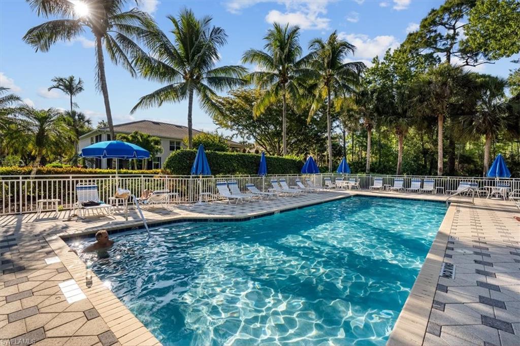 873 Carrick Bend Circle, Unit 101 Naples, FL 34110 - Photo 40 of 42 a view of outdoor space with swimming pool and patio