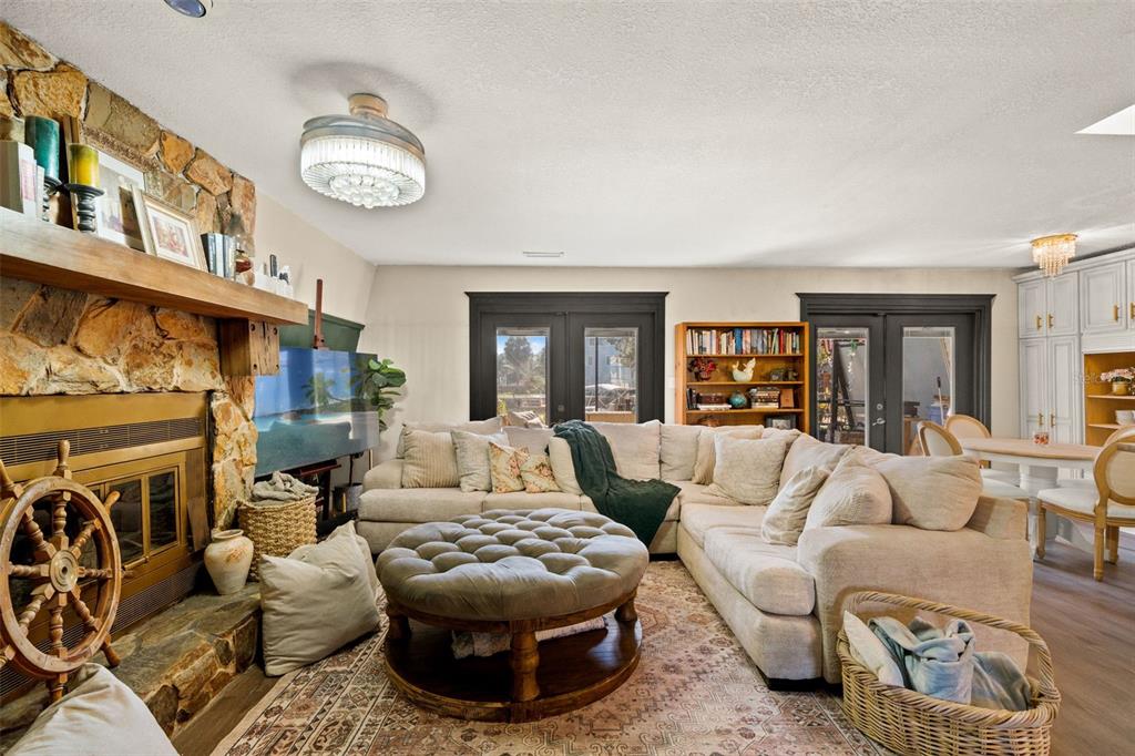 6271 Colony Circle Weeki Wachee, FL 34607 - Photo 13 of 60 a living room with furniture and a fireplace