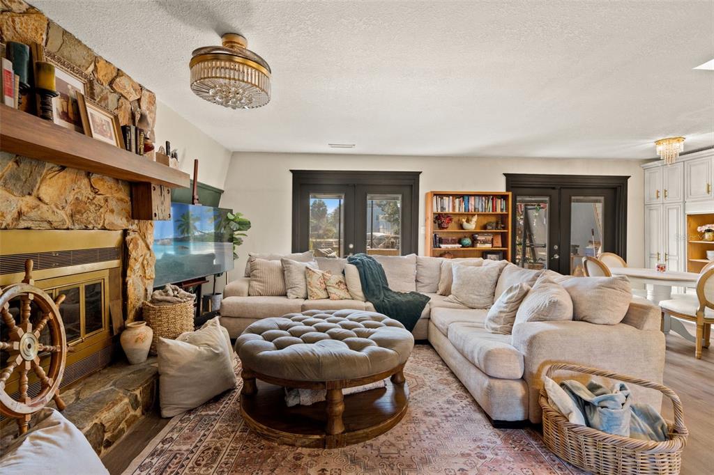 6271 Colony Circle Weeki Wachee, FL 34607 - Photo 14 of 60 a living room with furniture and a fireplace