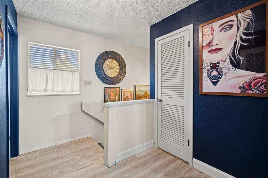 6271 Colony Circle Weeki Wachee, FL 34607 - Photo 26 of 60 a view of a hallway with entryway and wooden floor