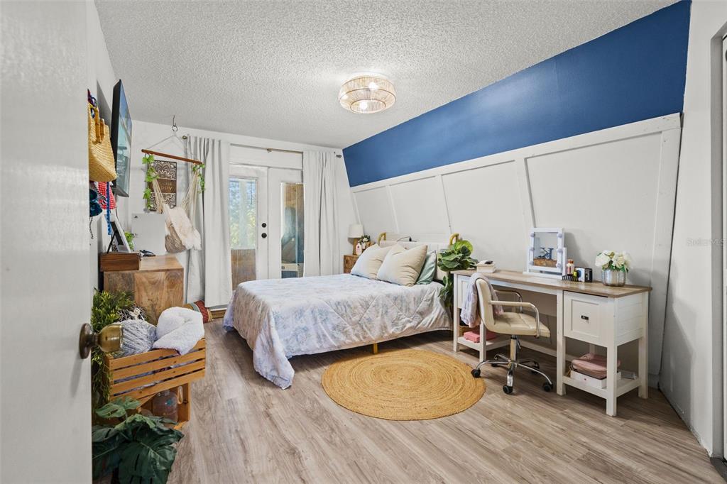 6271 Colony Circle Weeki Wachee, FL 34607 - Photo 28 of 60 a bedroom with a bed and a table