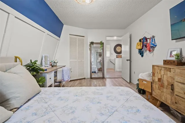 a view of a patio with couches table and chairs and potted plants
