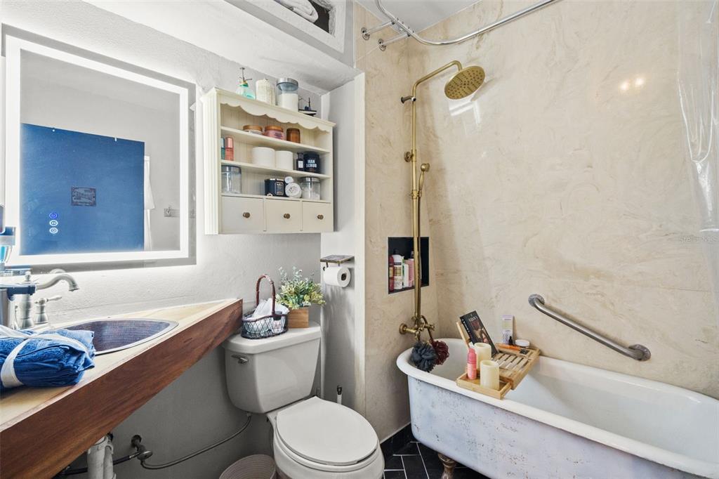 6271 Colony Circle Weeki Wachee, FL 34607 - Photo 31 of 60 a white toilet sitting next to a bathroom sink