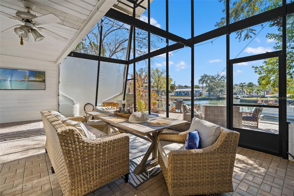 6271 Colony Circle Weeki Wachee, FL 34607 - Photo 41 of 60 a living room with furniture and a floor to ceiling window