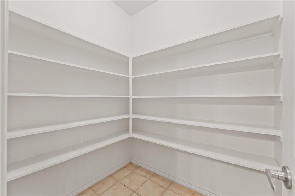 1701 Balboa Lane Allen, TX 75002 - Photo 13 of 30 a view of walk in closet with empty racks