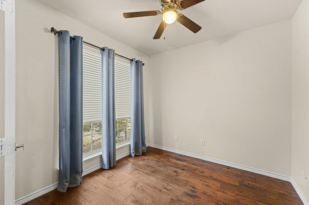 1701 Balboa Lane Allen, TX 75002 - Photo 4 of 30 an empty room with wooden floor closet and windows