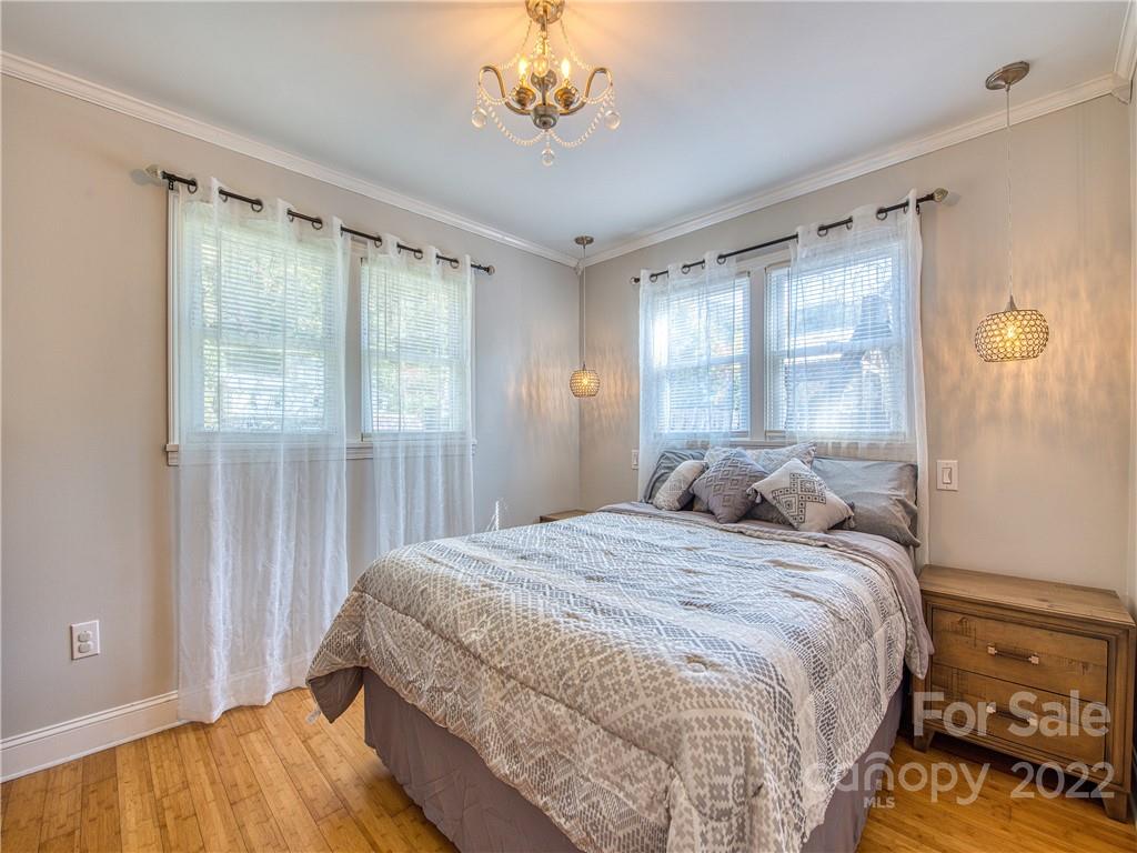550 Lickstone Road Waynesville, NC 28786 - Photo 18 of 24 a bedroom with a bed and a window