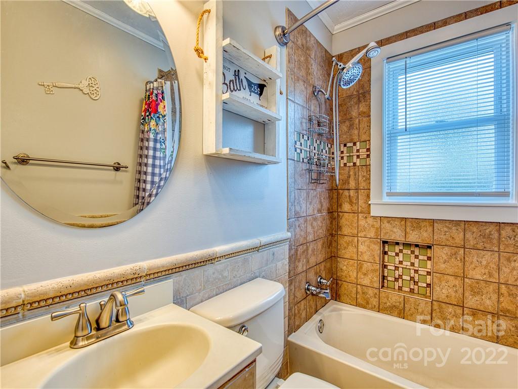 550 Lickstone Road Waynesville, NC 28786 - Photo 22 of 24 a bathroom with a bathtub and shower