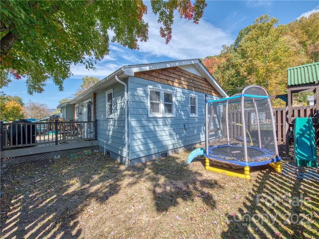550 Lickstone Road Waynesville, NC 28786 - Photo 5 of 24 a view of a house with a yard