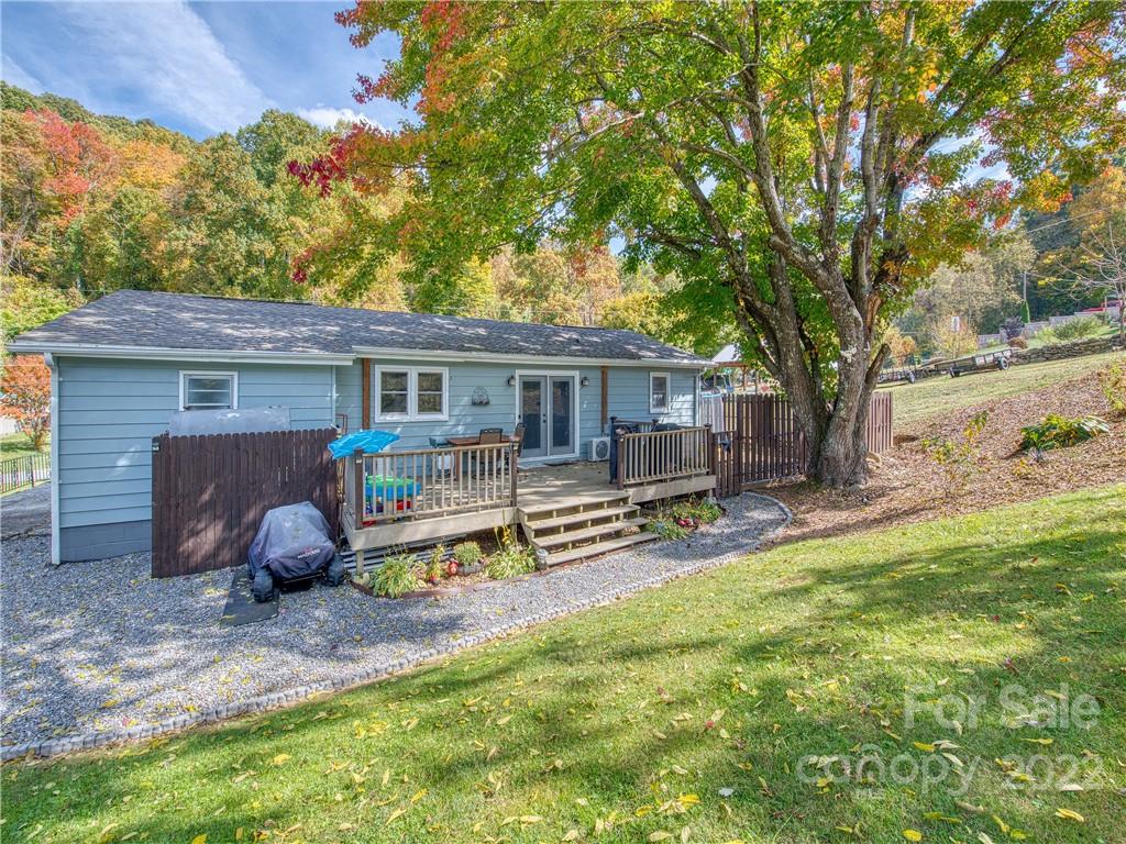 550 Lickstone Road Waynesville, NC 28786 - Photo 9 of 24 a house view with a seating space and garden