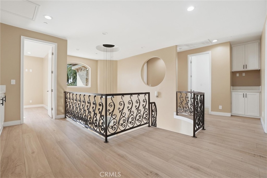 127 West 219th Place Carson, CA 90745 - Photo 19 of 69 Bright and airy second-level landing with linen storage and a convenient laundry chute.