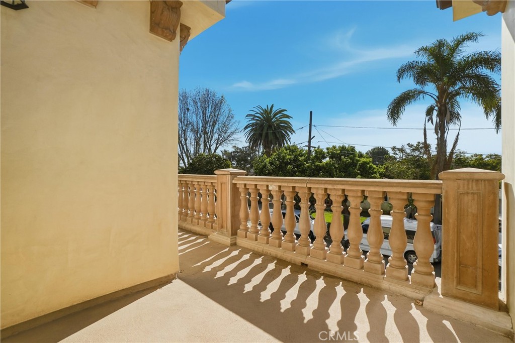 127 West 219th Place Carson, CA 90745 - Photo 24 of 69 Beautiful balcony with craftsman-style column railings, perfect for morning sun or evening stargazing.