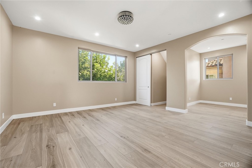 127 West 219th Place Carson, CA 90745 - Photo 35 of 69 Ample main bedroom to create your perfect home resort-like retreat. Featuring area for your own library, lounge, or home office. Ensuite with walk-in closet, laundry chute, double vanity, stand-up shower, bathtub, private WC room, and a private rooftop balcony for your personal oasis offering a seamless indoor-outdoor space for relaxation, yoga or morning coffee.