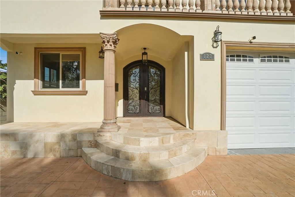 127 West 219th Place Carson, CA 90745 - Photo 51 of 69 Picture does no justice to this beautiful front porch with travertine flooring.