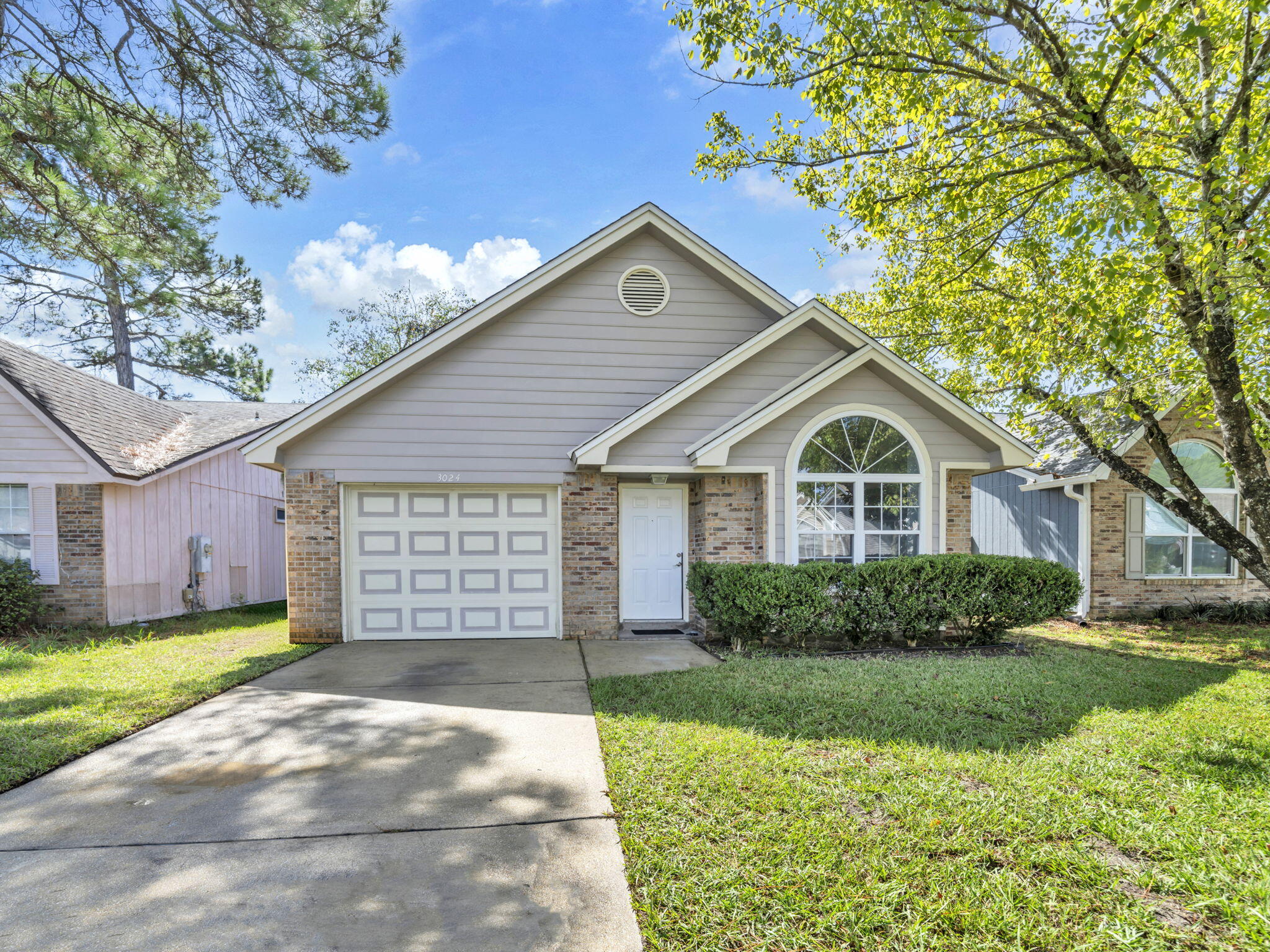 3024 Yorktown Circle Fort Walton Beach, FL 32547 - Photo 1 of 24 a view of a house with yard and plants