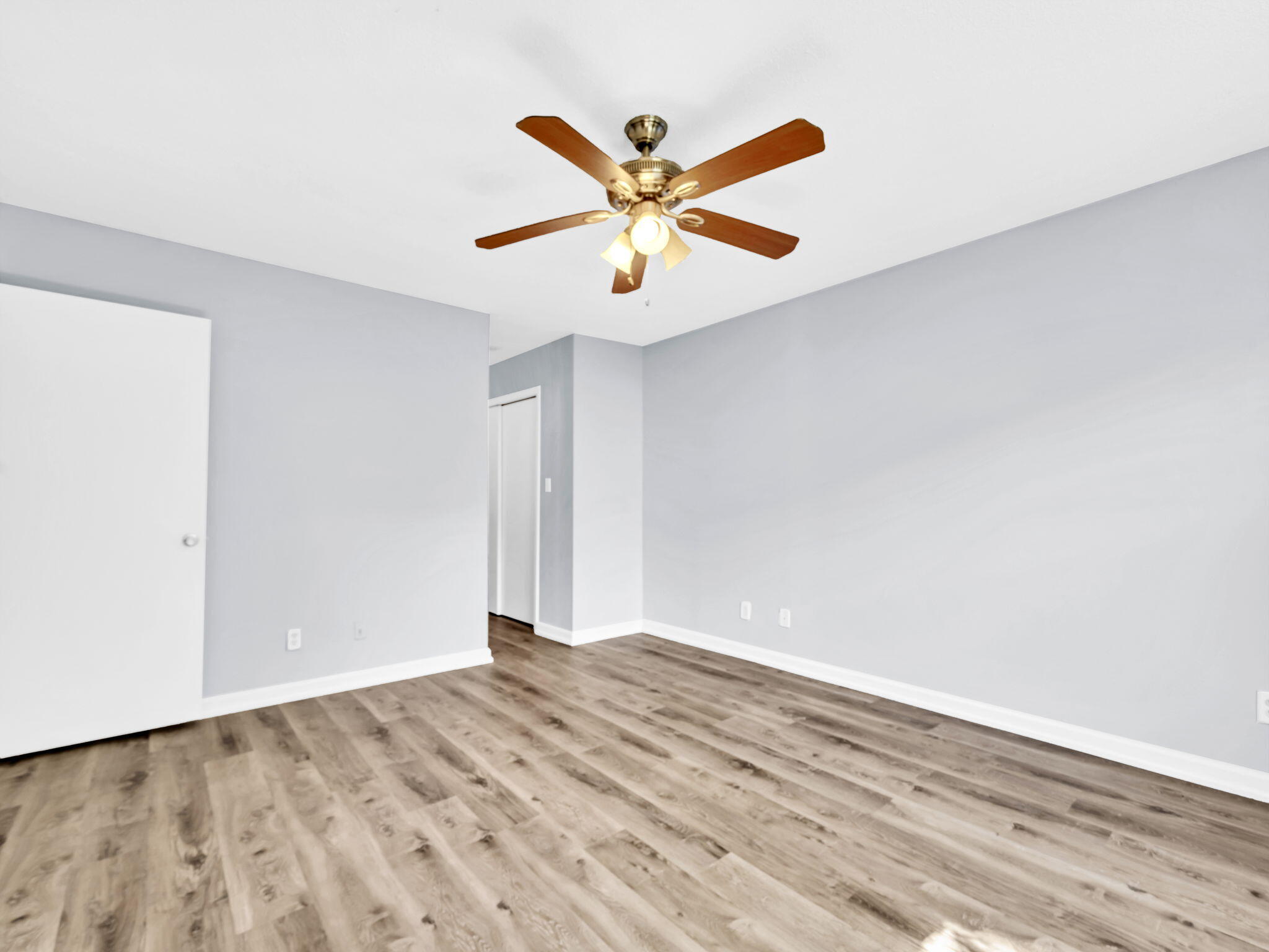 3024 Yorktown Circle Fort Walton Beach, FL 32547 - Photo 15 of 24 a view of an empty room with window and wooden floor