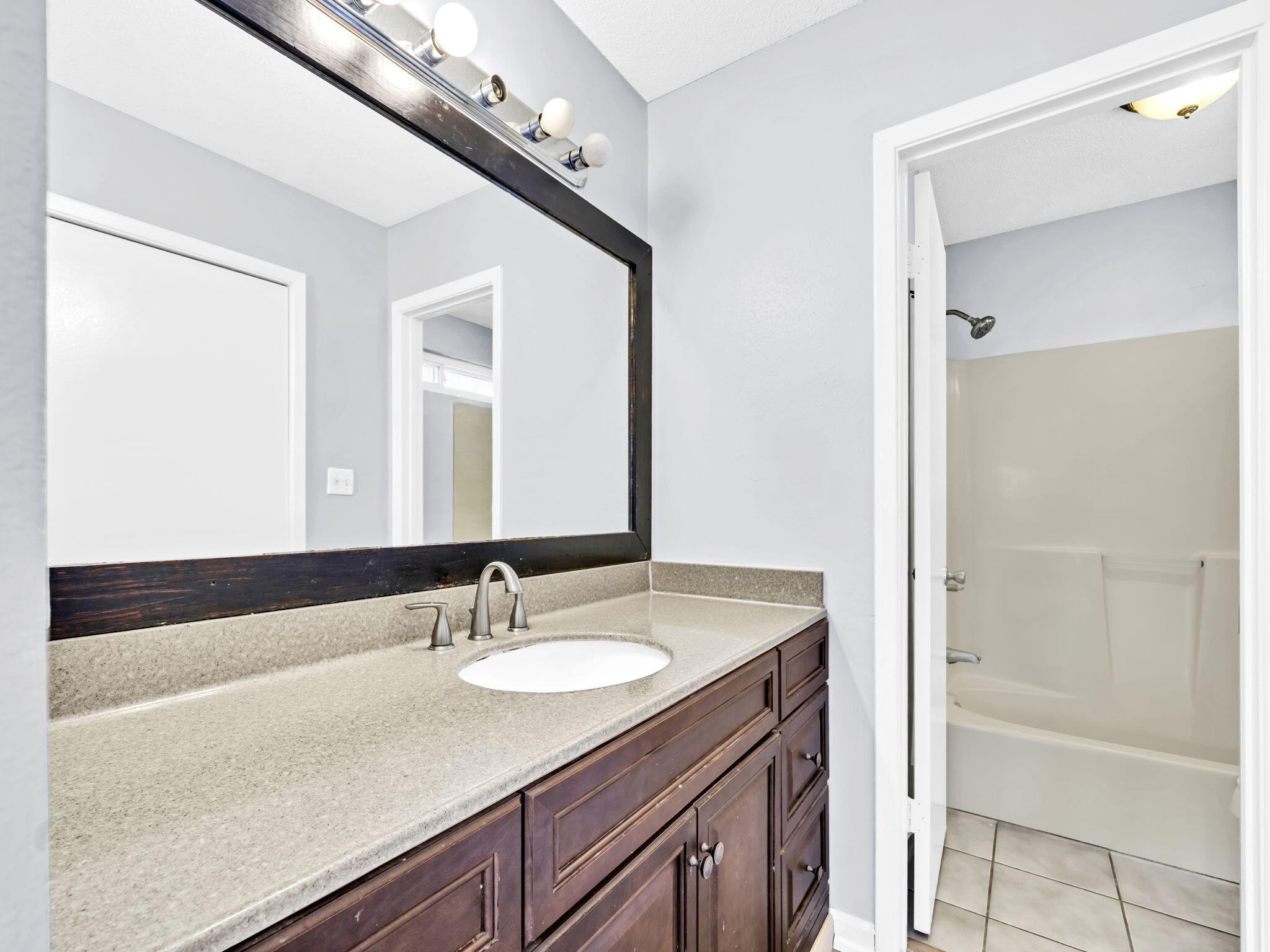 3024 Yorktown Circle Fort Walton Beach, FL 32547 - Photo 16 of 24 a bathroom with a sink and a mirror