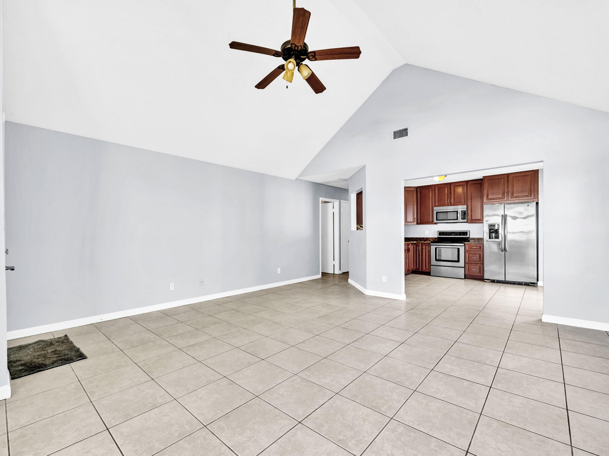 3024 Yorktown Circle Fort Walton Beach, FL 32547 - Photo 5 of 24 a view of a kitchen with a sink and a refrigerator cabinets