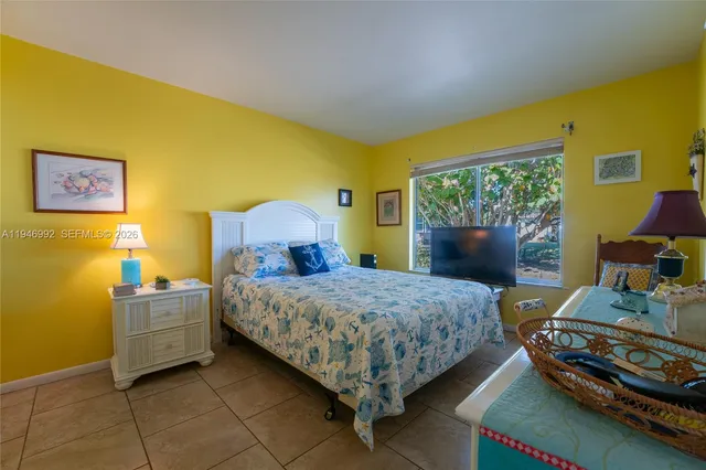 a bedroom with a bed and a table