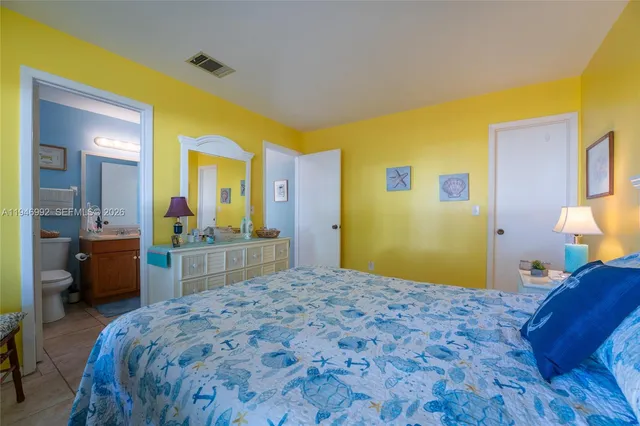 a bedroom with a bed and a view of bedroom