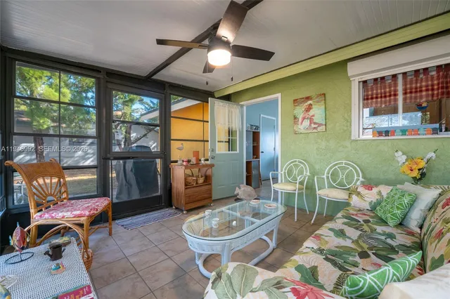 a living room with furniture and a window