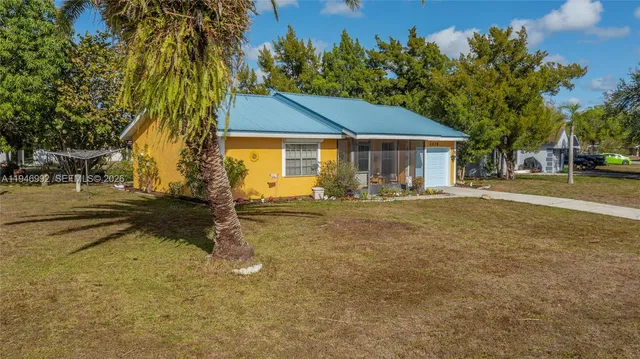 front view of a house with a yard
