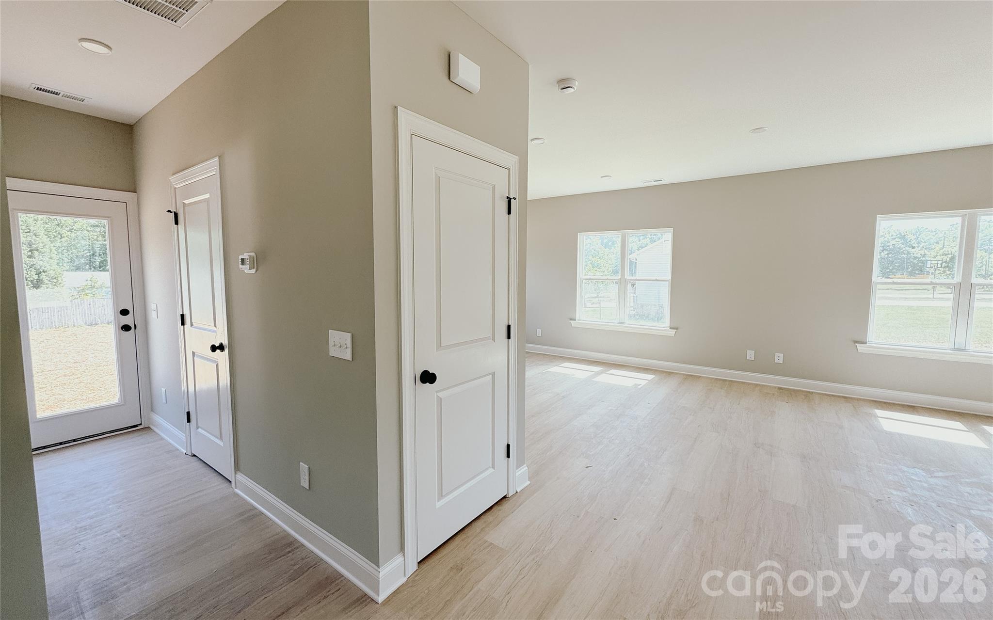 1455 West Ridge Road Salisbury, NC 28147 - Photo 9 of 26 a view of an empty room with window and wooden floor