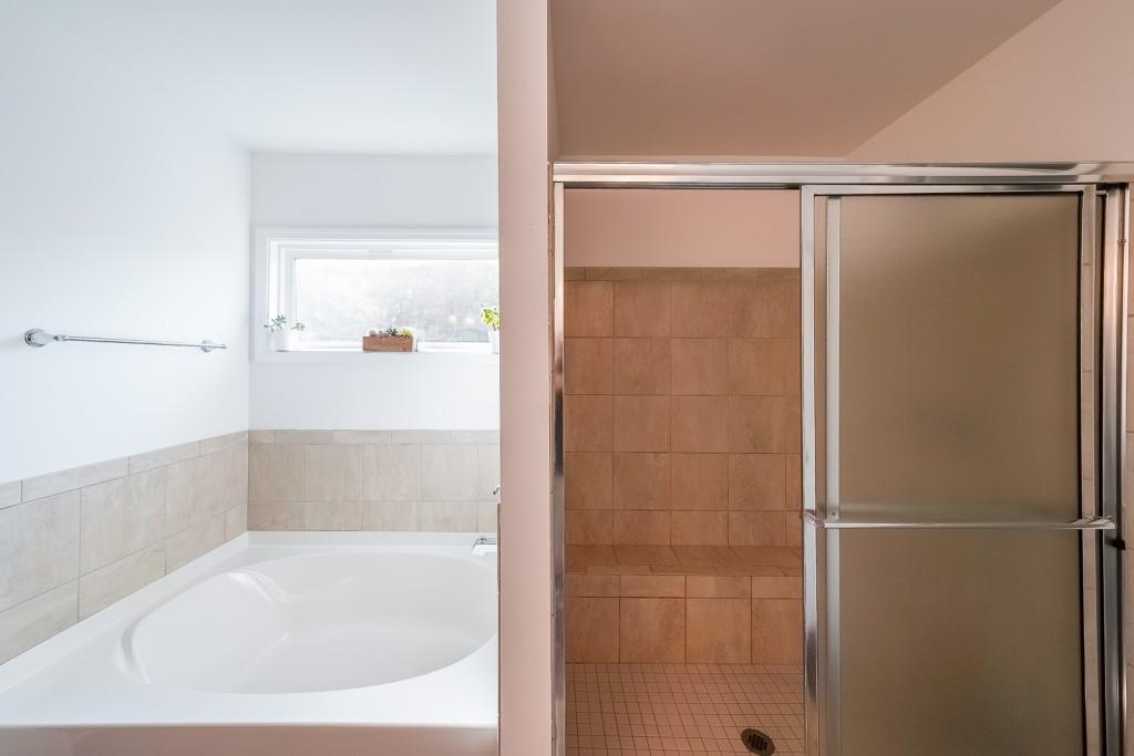 5116 Barton Pass Northwest Acworth, GA 30101 - Photo 18 of 42 a bathroom with a shower and a bath tub