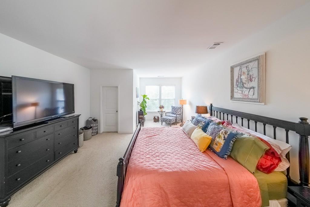 5116 Barton Pass Northwest Acworth, GA 30101 - Photo 19 of 42 a bedroom with bed and a flat screen tv