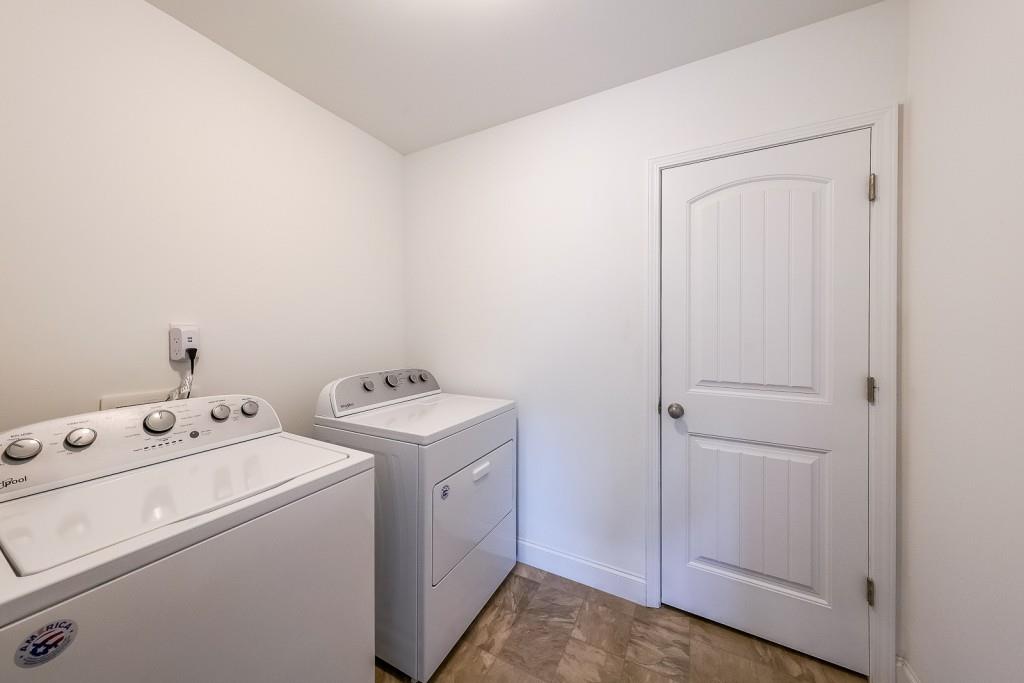 5116 Barton Pass Northwest Acworth, GA 30101 - Photo 20 of 42 a view of washer and dryer with bathroom in the background
