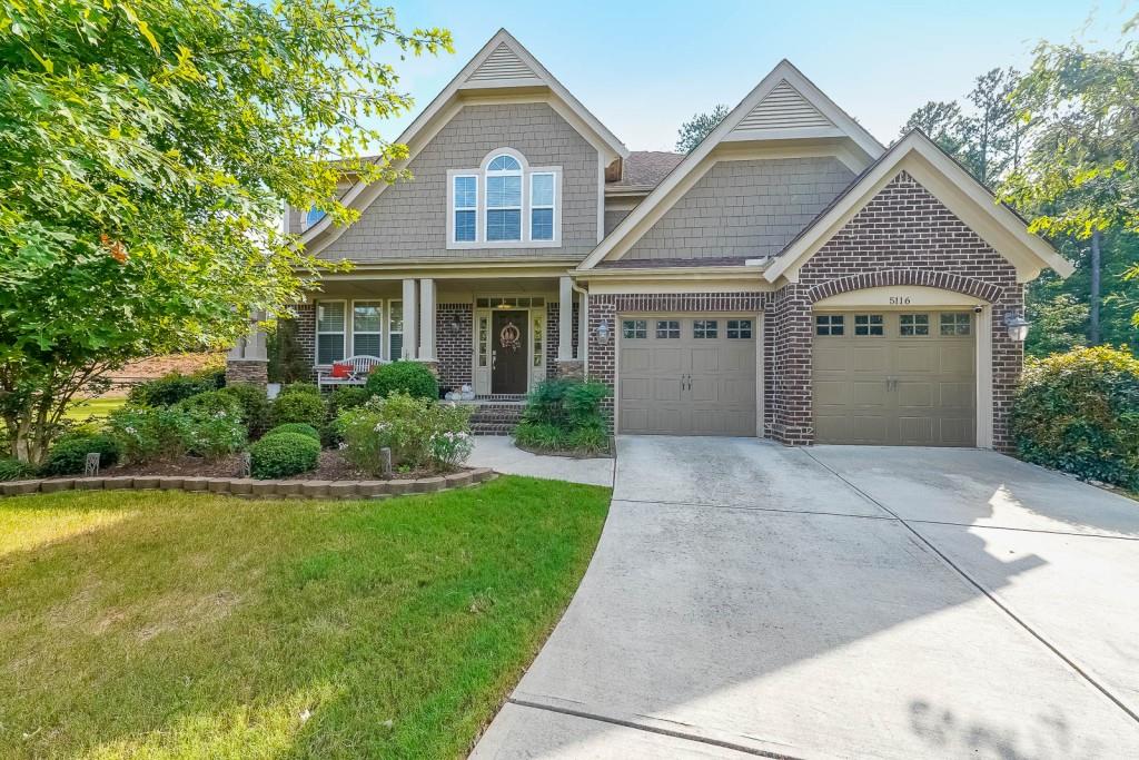 5116 Barton Pass Northwest Acworth, GA 30101 - Photo 2 of 42 a front view of a house with a yard