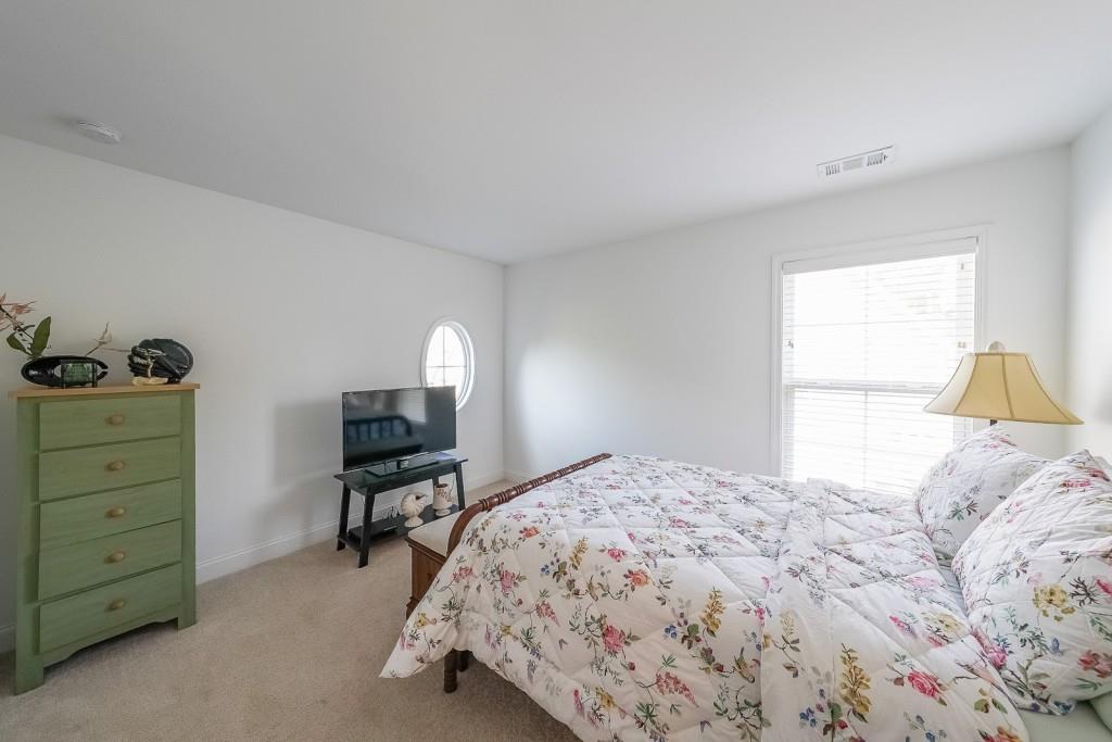 5116 Barton Pass Northwest Acworth, GA 30101 - Photo 25 of 42 a bedroom with a bed and a window