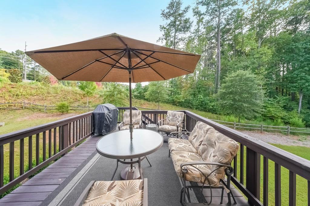 5116 Barton Pass Northwest Acworth, GA 30101 - Photo 36 of 42 a view of balcony with furniture and umbrella