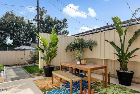 a view of a backyard with a patio
