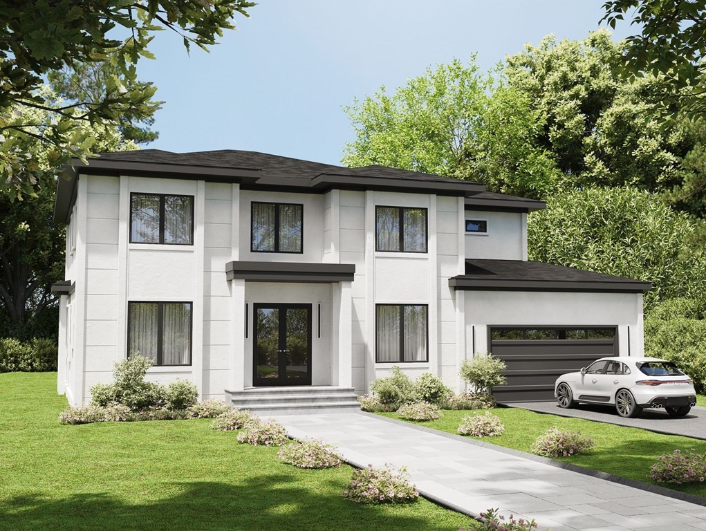 a front view of a house with a garden and yard