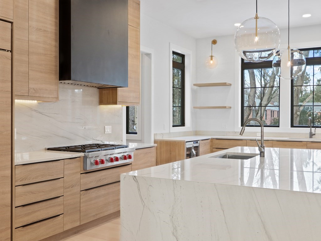 27 Nightingale Path Newton, MA 02459 - Photo 2 of 13 a kitchen with stainless steel appliances granite countertop a sink and a stove