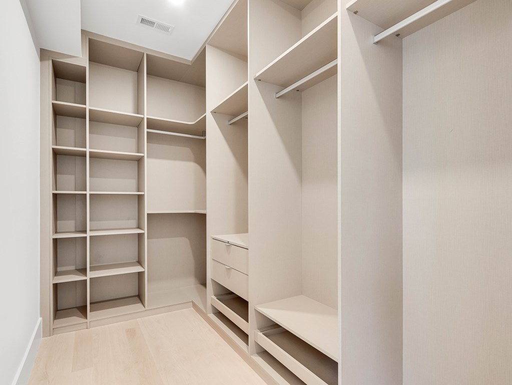 27 Nightingale Path Newton, MA 02459 - Photo 8 of 13 a view of walk in closet with empty racks