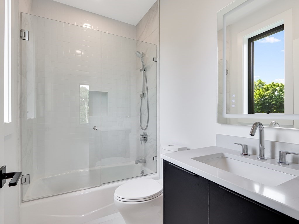 27 Nightingale Path Newton, MA 02459 - Photo 10 of 13 a bathroom with a sink a toilet and shower