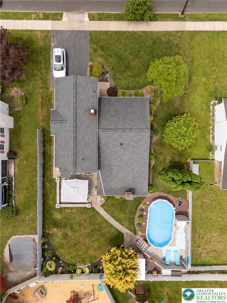 2087 Hopewell Road Bethlehem, PA 18017 - Photo 4 of 38 An aerial view showcases a residential property with a private pool and well-maintained grounds.