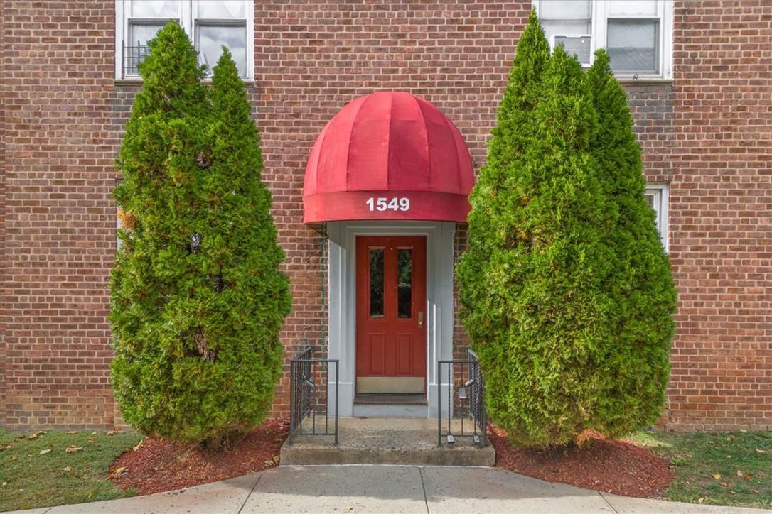 1549 Central Park Avenue, Unit 12G Yonkers, NY 10710 - Photo 1 of 1 a front view of a house with a garden