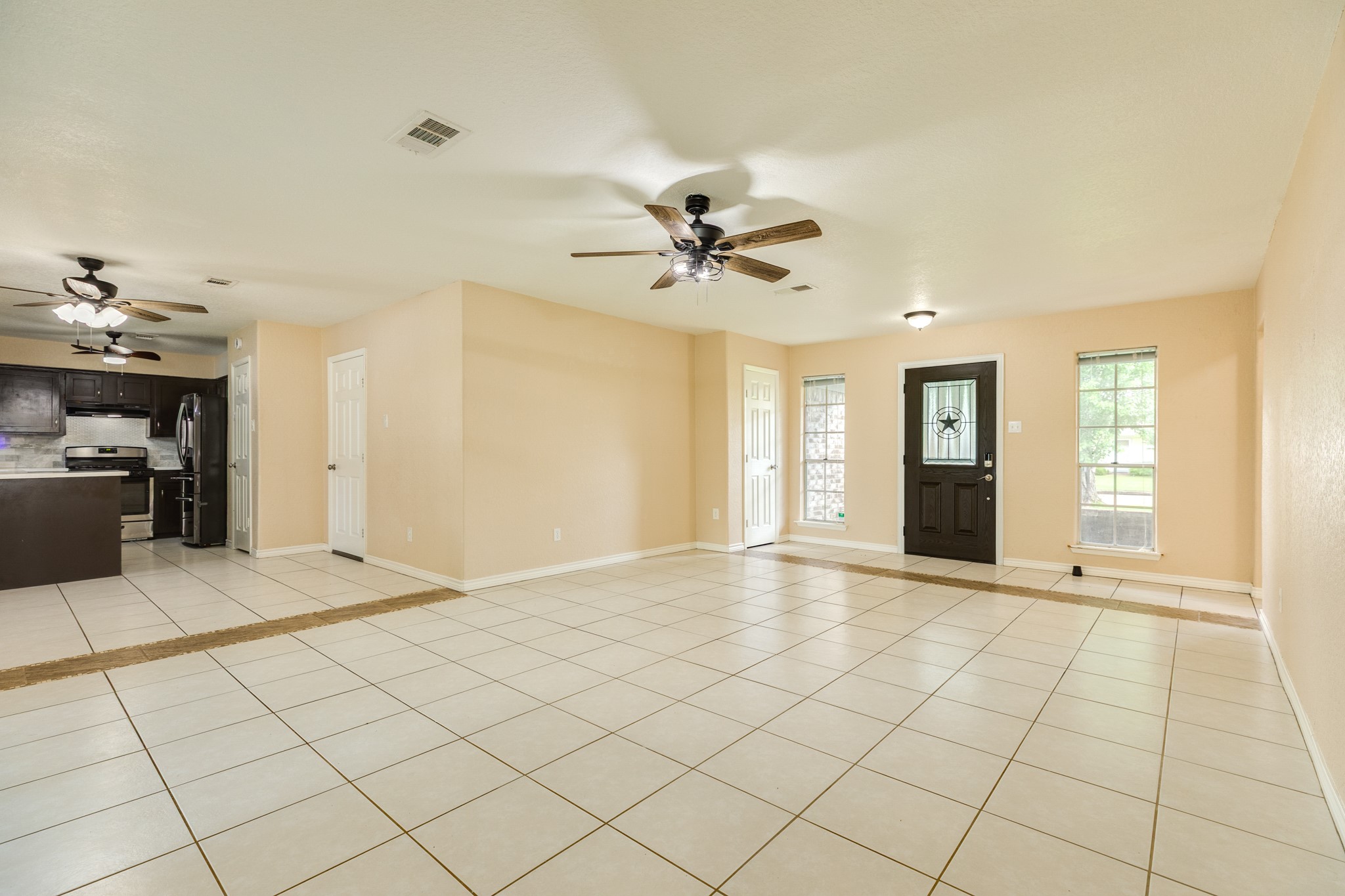 128 Houston Street Angleton, TX 77515 - Photo 12 of 25 a view of an empty room with window and cabinet