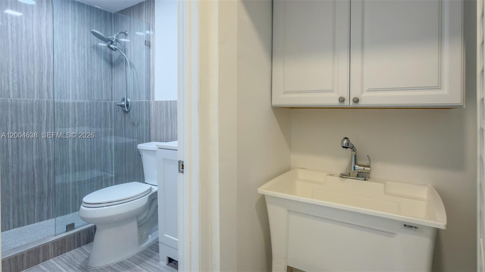 1690 Daytonia Road Miami Beach, FL 33141 - Photo 34 of 88 a bathroom with a sink a toilet and shower